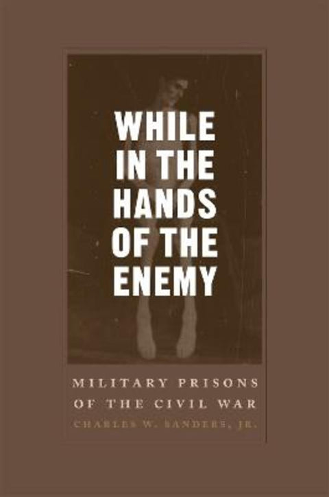While in the Hands of the Enemy by Charles W. Sanders Jr - 9780807130612